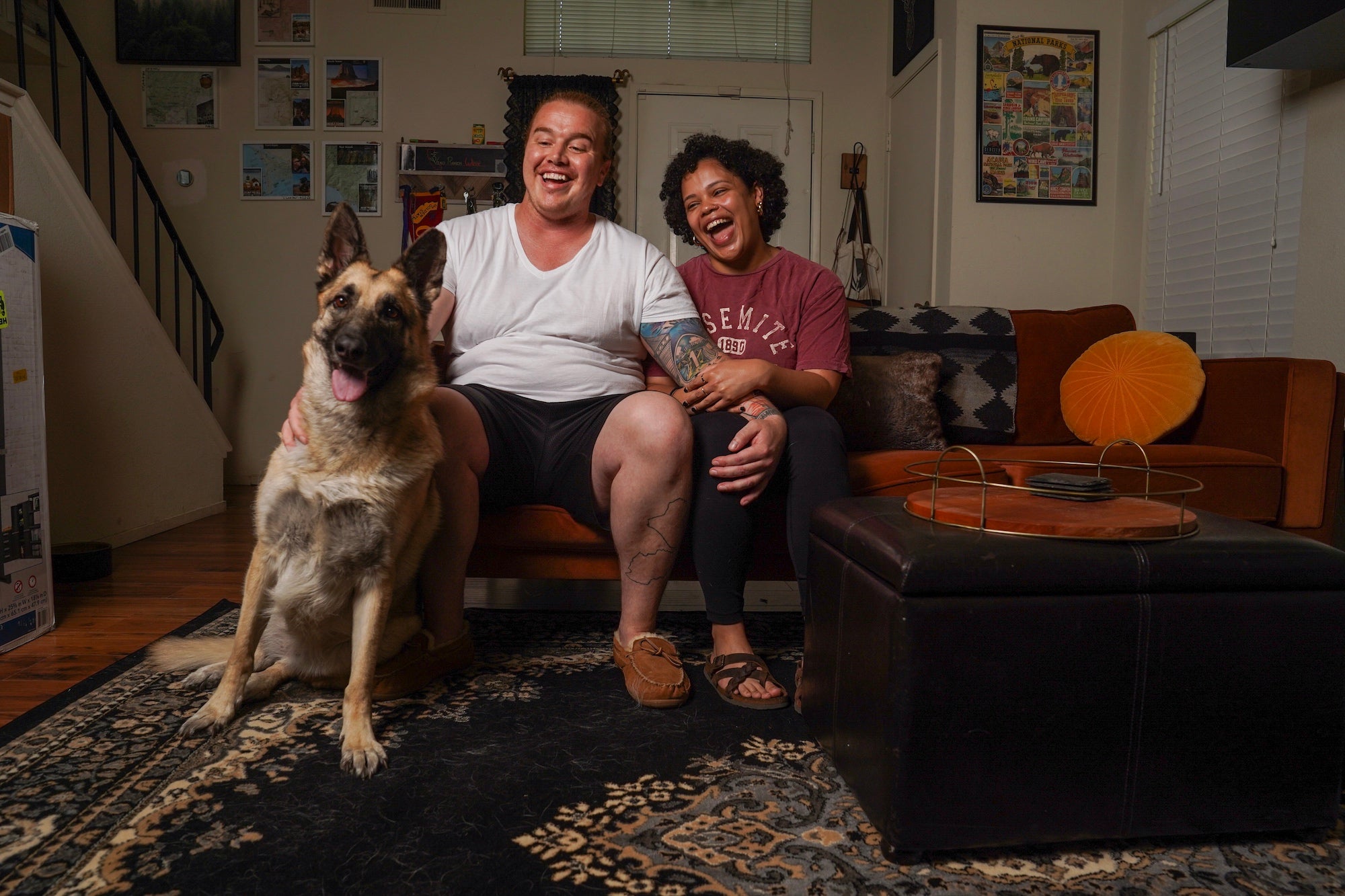 Matthew Treviño, Emily Fletcher and their dog Rosie, a german shepherd mix, sit on a couch at their home in Sacramento. Matthew is part of a ˽̳ Davis Health clinical trial for a hormonal birth control gel for men.
