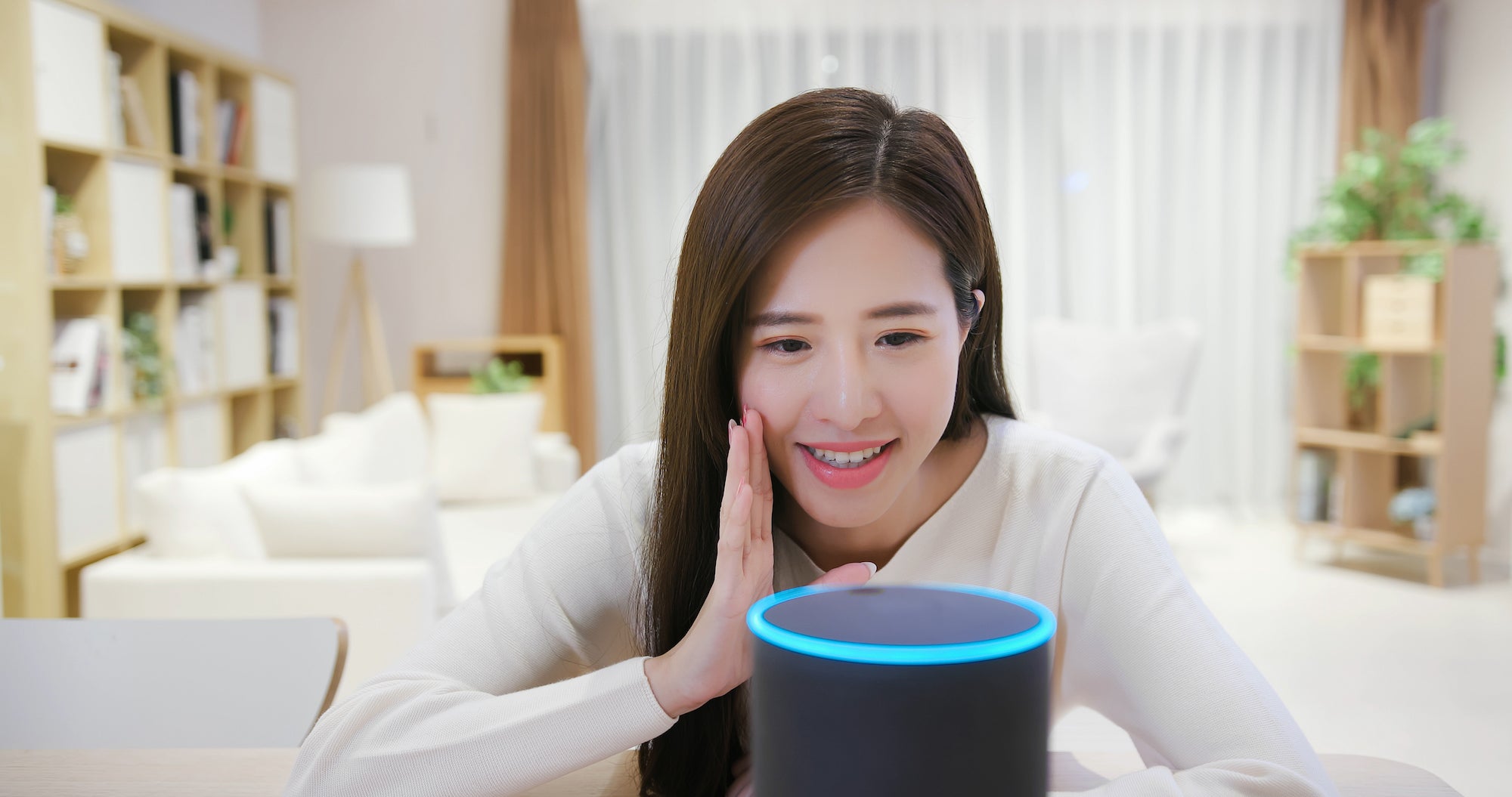 Woman speaking into her Alexa device. ˽̳ Davis researchers have found that people speak differently when talking with voice artificial intelligence.