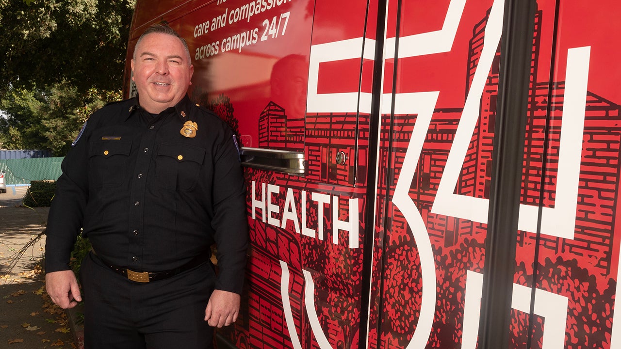 Nathan Trauernicht, chief of the ˽̳ Davis Fire Department, stands beside the Health 34 van.