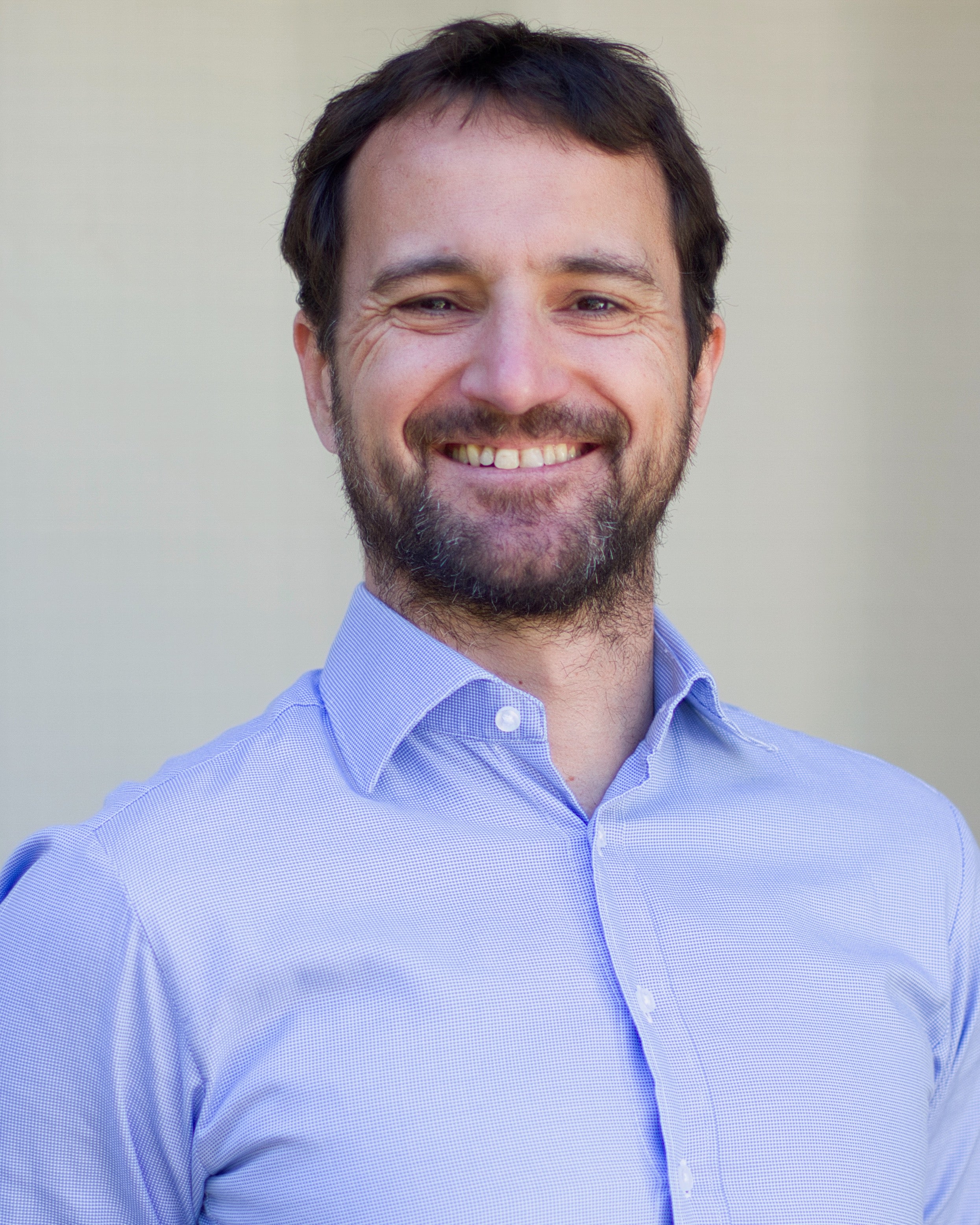 Head shot of ˽̳ Davis agronomist Alessandro Ossola, smiling in light blue button-up shirt