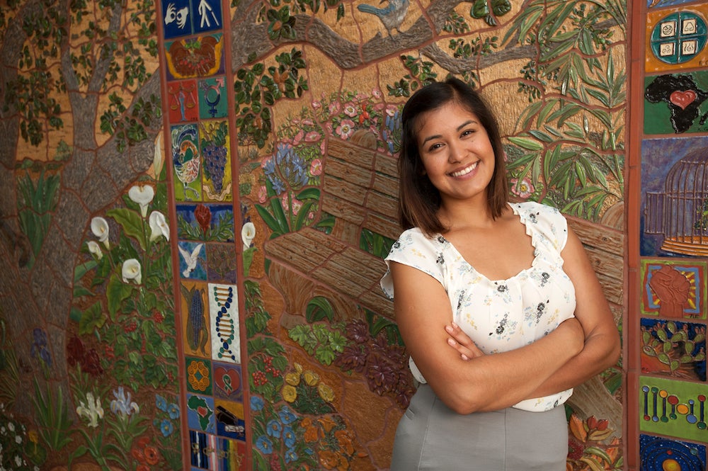 Valeria Garcia, a community development graduate studies major, stands in front of a mural in the Student Community Center on Friday August 8, 2014 at ˽̳ Davis.