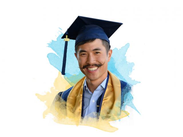 A smiling ˽̳ Davis graduate with an amazing mustache