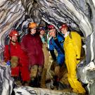 Five ˽̳ Davis researchers inside marble rock formations of cave