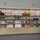 Rows of books, mugs, pillow in store display at ˽̳ Davis Gorman museum