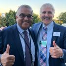 Ashish Jha, White House official, and Richard Coris, ˽̳ Davis faculty, both giving thumbs-up outside the White House
