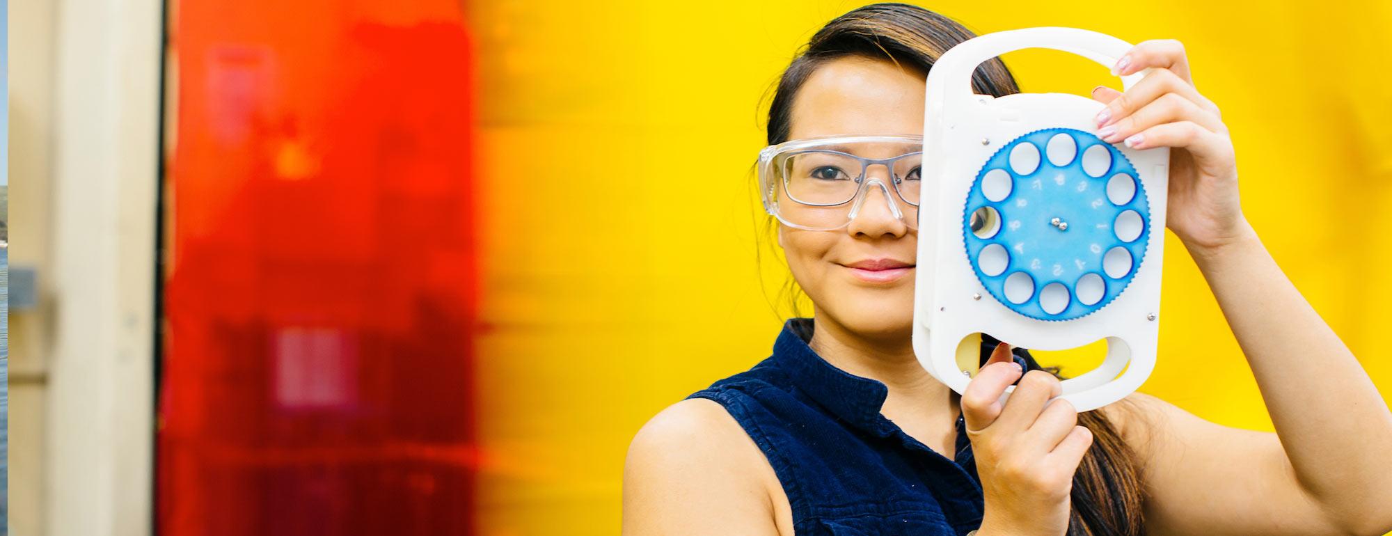 A ˽̳ Davis Biomedical Engineering alum poses with here vision improvement invention